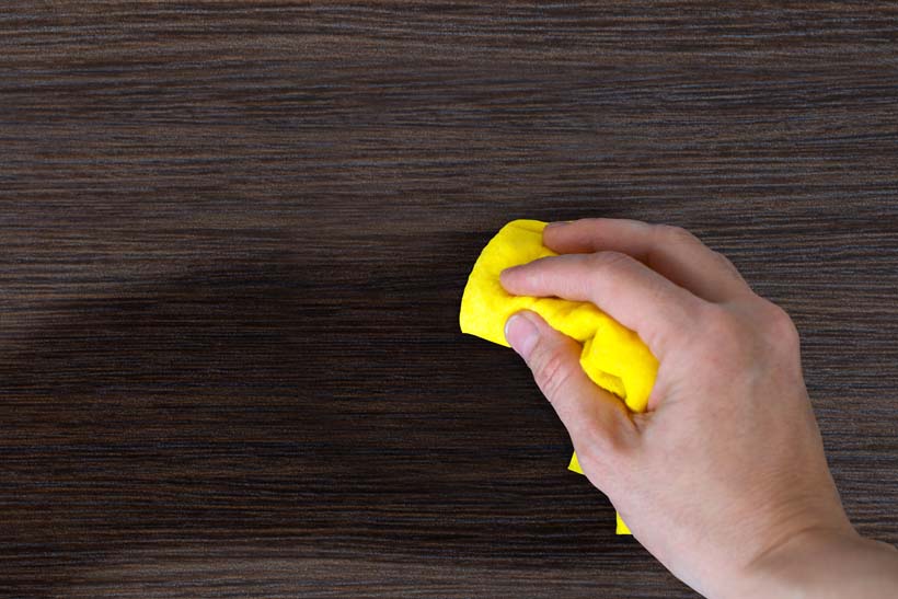 Hand dust the wood furniture