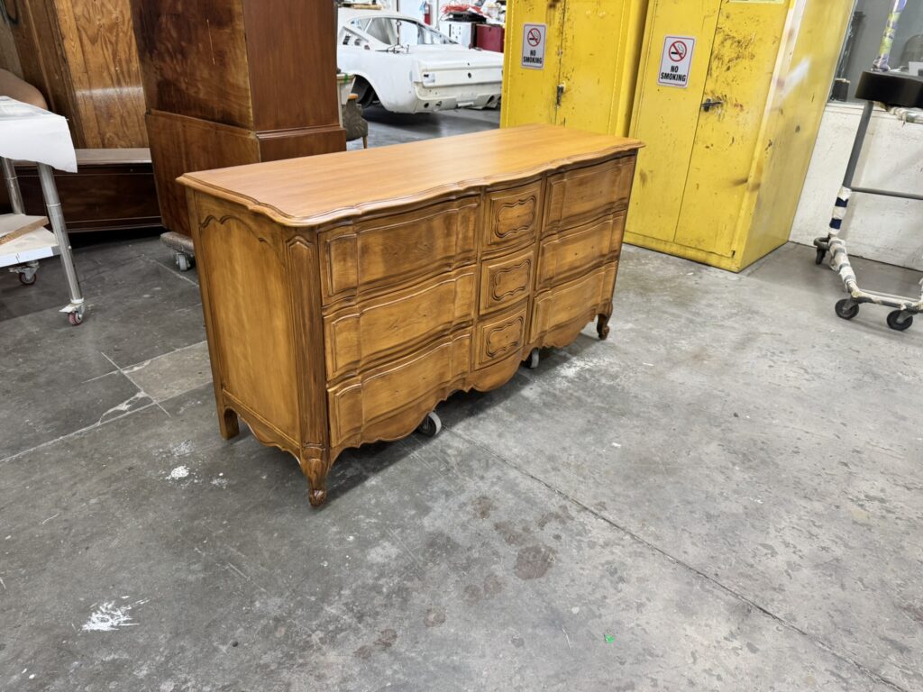 Angelus dresser after restoration - side angle showing refinished wood